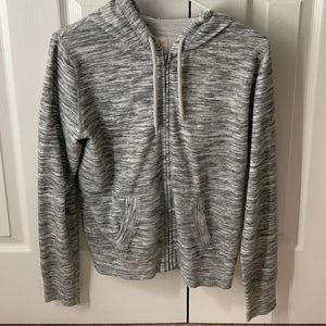 Gray and white sweater zip up
